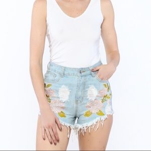 Floral embroidered distressed denim shorts
